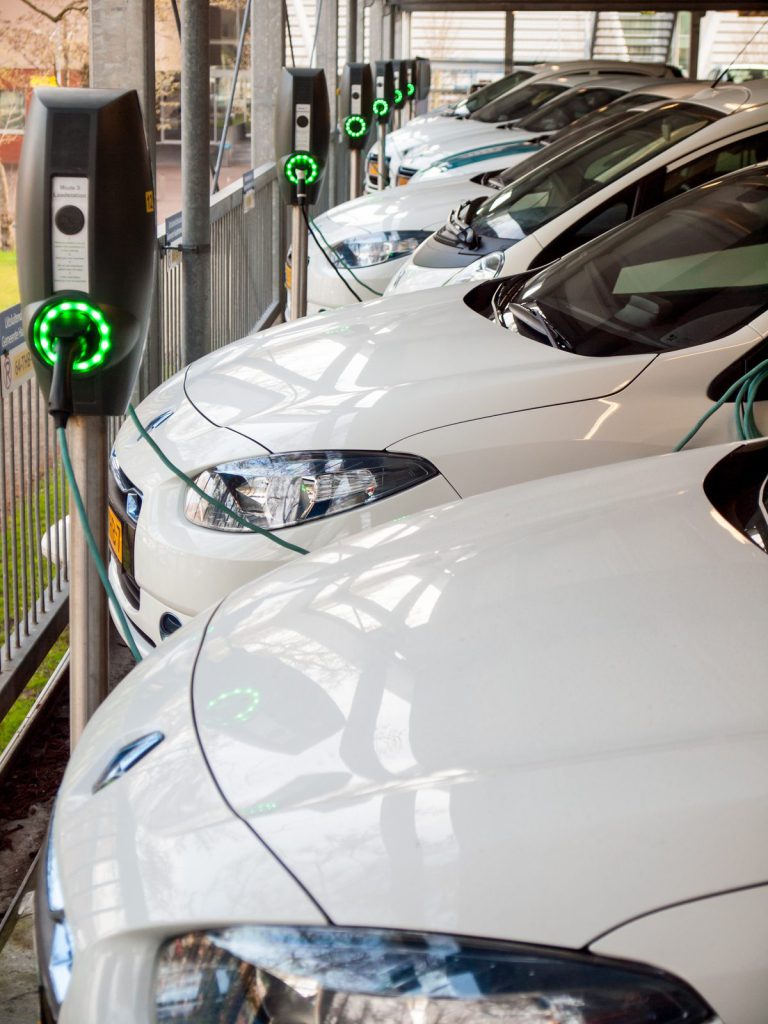 Electric company cars at charging stations